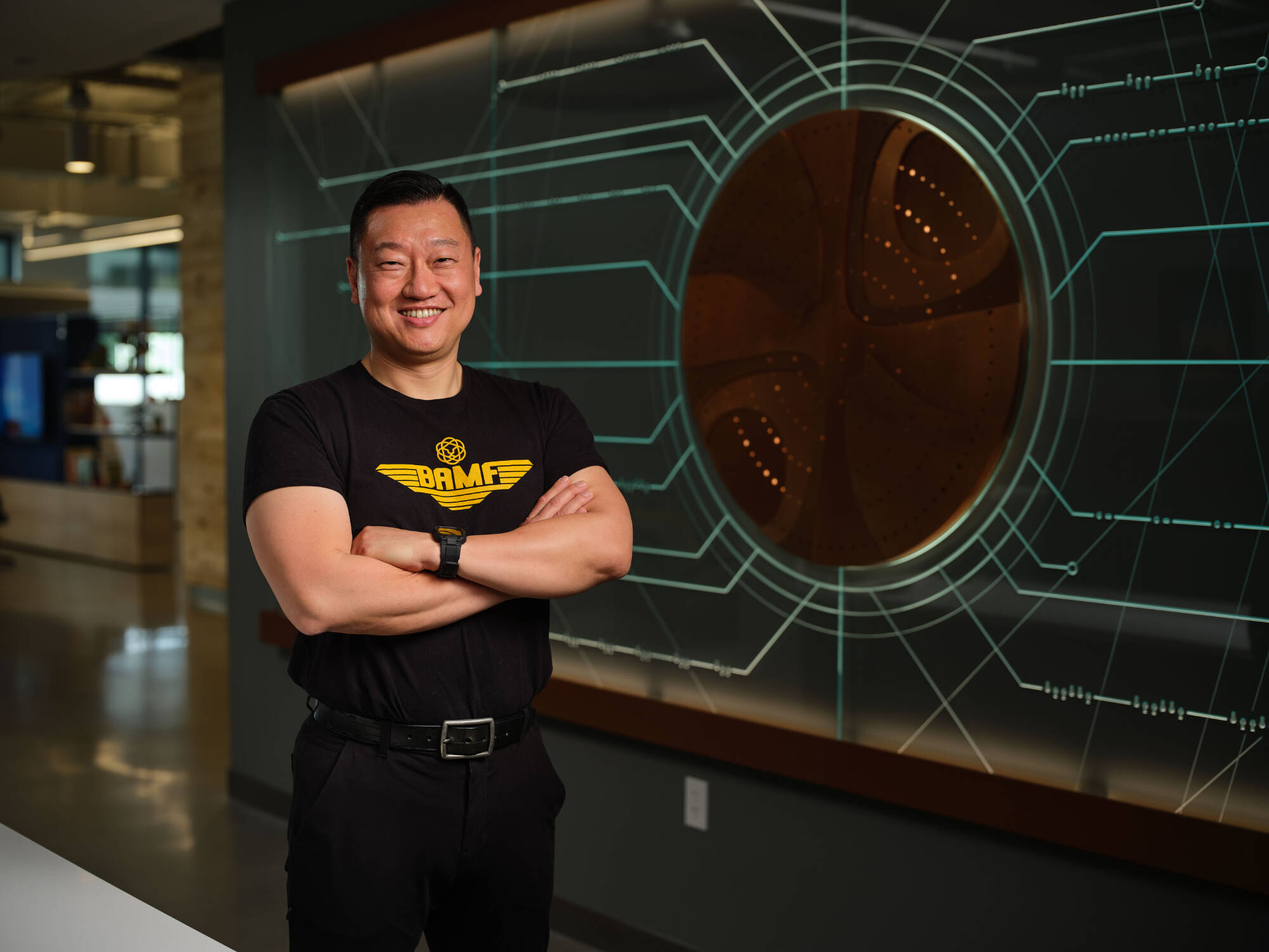 Anthony Change posing with arms crossed